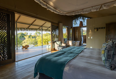 Chundu Island Lodge thatched tented suite peaceful private deck Zambezi River Zimbabwe