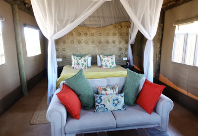 Daka Plains Camp privately owned thatched main area plunge pool library Hwange Zimbabwe