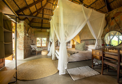 Bumbusi Wilderness Camp luxury suite vibrant African décor Hwange National Park Zimbabwe