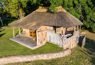 Bumbusi Wilderness Camp thatched stone chalet discerning safari Hwange National Park