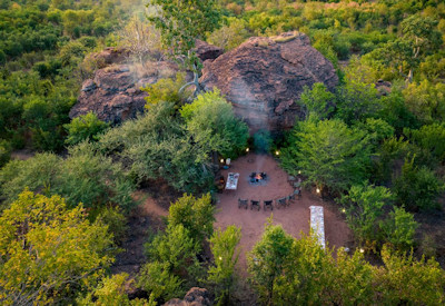 Bumbusi Wilderness Camp outdoor boma area farm-to-table dining Hwange Zimbabwe
