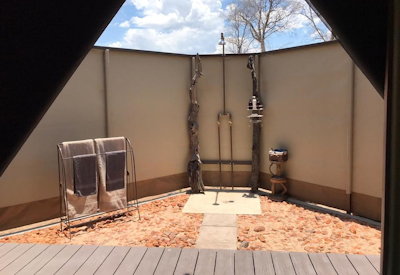 Ingwe Pan Camp outdoor shower flush toilet hot cold water Mana Pools Zimbabwe