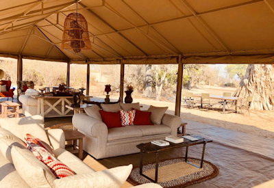 Ingwe Pan Camp tented central area lounge bar indoor outdoor dining firepit Zimbabwe