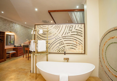 Insika Lodge large en-suite bathroom bathtub double shower Victoria Falls Zimbabwe