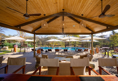 Insika Lodge breakfast dining area mopane woodland waterhole views Victoria Falls Zimbabwe