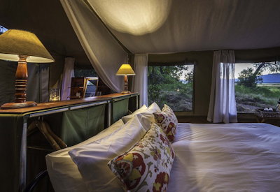 John's Camp large king bed comfortable bedding bucket shower Mana Pools Zimbabwe