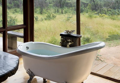 Khayelitshe House freestanding bathtub views Matobo Hills Zimbabwe off-grid solar