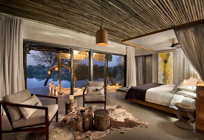 Matetsi Victoria Falls luxurious bedroom Zambezi River views private game reserve Zimbabwe