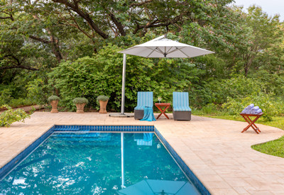 Mbano Manor Hotel swimming pool manicured private gardens Victoria Falls Zimbabwe
