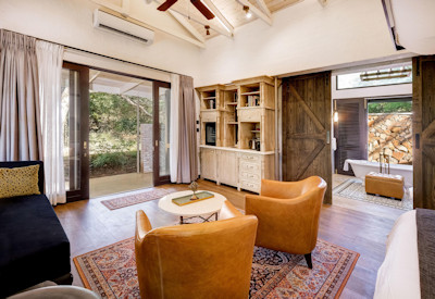 Mbano Manor Hotel guest rooms surrounded ancient teak forest Victoria Falls Zimbabwe