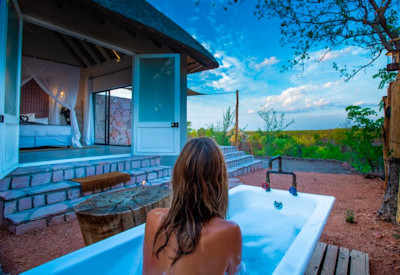 Nantwich Lodge Hwange en-suite bathroom outdoor bathtub solar geyser Zimbabwe
