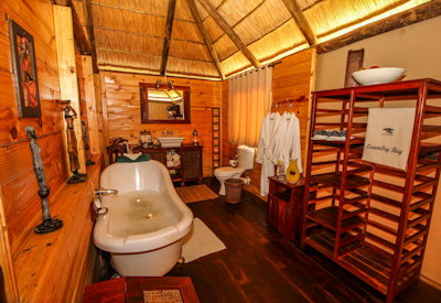 Nehimba Lodge en-suite bathroom flush toilet outdoor shower Hwange Zimbabwe