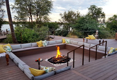 Old Drift Lodge sunken firepit wooden deck Zambezi River banks after-dinner cocktails Zimbabwe