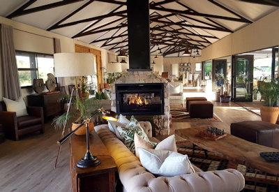 Old Drift Lodge main lounge fireplace 360-degree views Zambezi River National Park