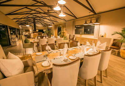 Old Drift Lodge indoor dining area Zambezi River views Zimbabwe safari lodge