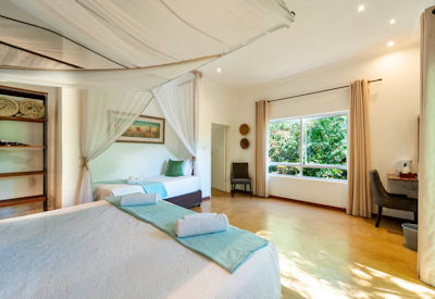PheZulu Guest Lodge triple room air conditioning mosquito net Victoria Falls Zimbabwe