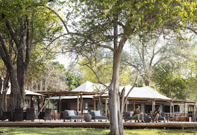 Ruckomechi Camp canvas central area lounge library infinity pool fire pit Zimbabwe