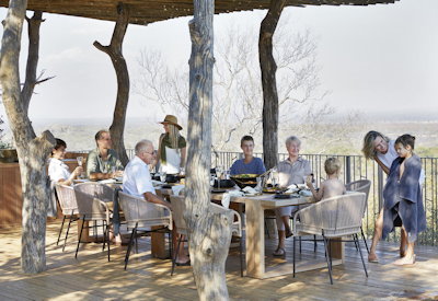 Singita Malilangwe House outdoor dining Malilangwe Dam views Zimbabwe exclusive-use villa