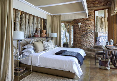 Singita Pamushana Lodge queen bedroom private game viewing deck Malilangwe Zimbabwe