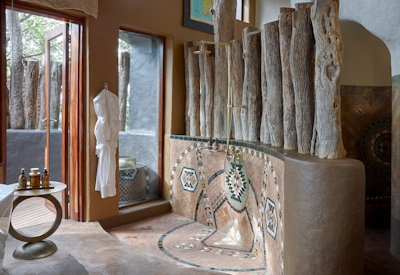 Singita Pamushana Lodge indoor outdoor shower en-suite Malilangwe Wildlife Reserve Zimbabwe