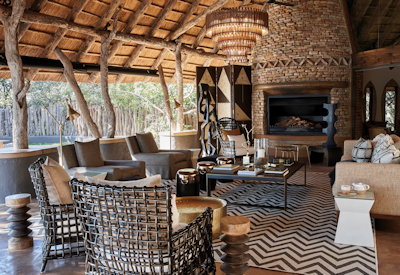 Singita Pamushana Lodge fire-lit lounge library wine cellar Malilangwe Zimbabwe
