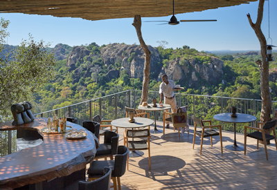 Singita Pamushana Lodge outdoor dining Malilangwe Dam views Zimbabwe Relais Chateaux
