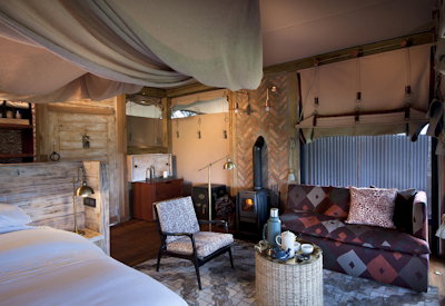 Somalisa Camp luxury tented suite wood-burning fireplace Hwange National Park Zimbabwe