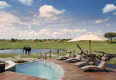 Somalisa Camp waterhole wildlife day night Hwange National Park Zimbabwe