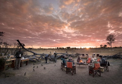 Somalisa Expeditions Camp sunset firepit after-dinner drinks African stars Hwange Zimbabwe