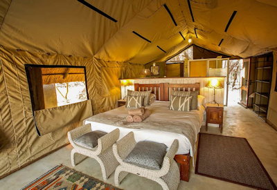 The Hide Hwange tented safari suite private verandah deck chairs Hwange Zimbabwe