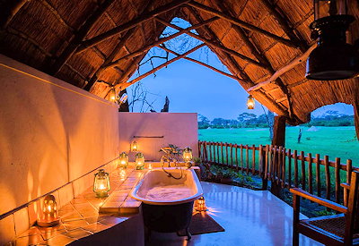 The Hide Hwange en-suite bathroom indoor outdoor shower freestanding bath Zimbabwe
