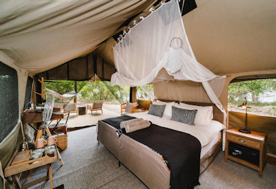 Tsowa Safari Island sandy path luxury tented suite Zambezi River island Zimbabwe