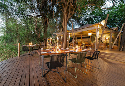 Tsowa Safari Island sunken firepit river edge evening lanterns Zambezi Zimbabwe